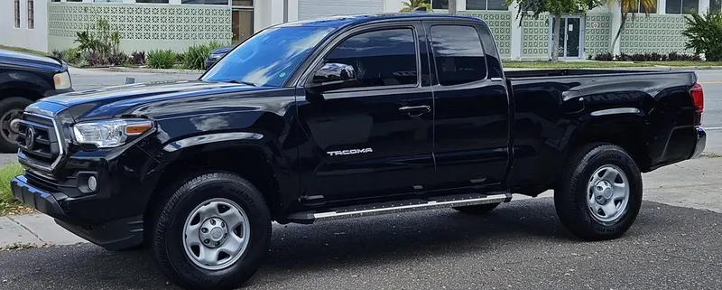 Black Toyota Tacoma with mirror-like wax finish at St Pete Auto Detail